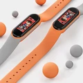 Kép 6/6 - Xiaomi Mi Band 5/6 „Correa” sport szilikon szíj (fekete/narancs)